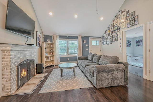 66 Eimer St, Patchogue, NY 11772 - living room featuring dark wood-type flooring, a brick fireplace, high vaulted ceiling, and recessed lighting