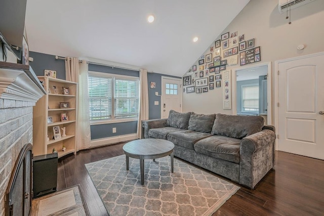 66 Eimer St, Patchogue, NY 11772 - living area with a fireplace, dark wood-style flooring, high vaulted ceiling, an AC wall unit, and recessed lighting