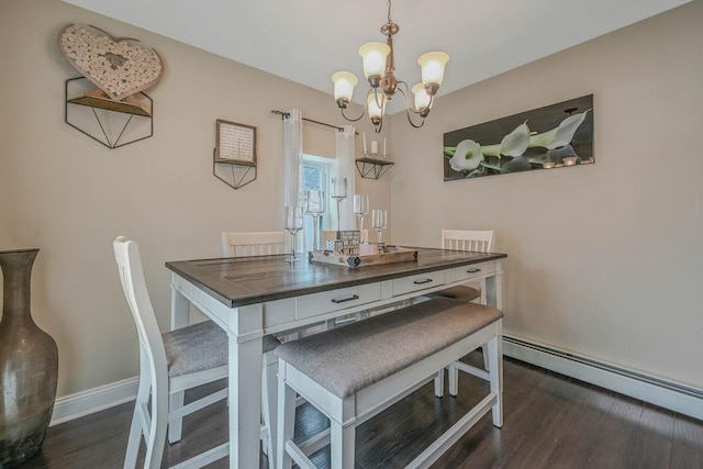 66 Eimer St, Patchogue, NY 11772 - dining room featuring a baseboard heating unit, a chandelier, and dark wood-style flooring