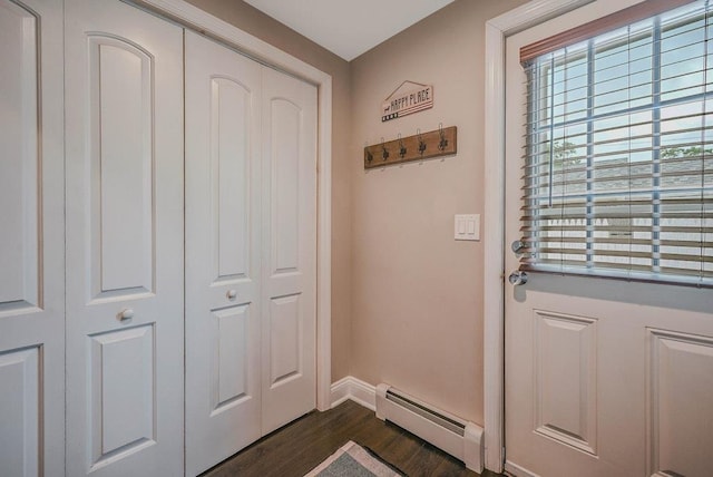 66 Eimer St, Patchogue, NY 11772 - entryway with a baseboard heating unit and dark wood-type flooring