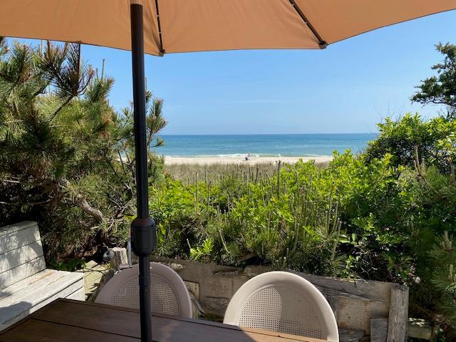 54 Lewis Walk, Cherry Grove, NY 11782 - view of patio / terrace with view of water and beach