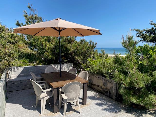 54 Lewis Walk, Cherry Grove, NY 11782 - deck with a water view and outdoor dining space
