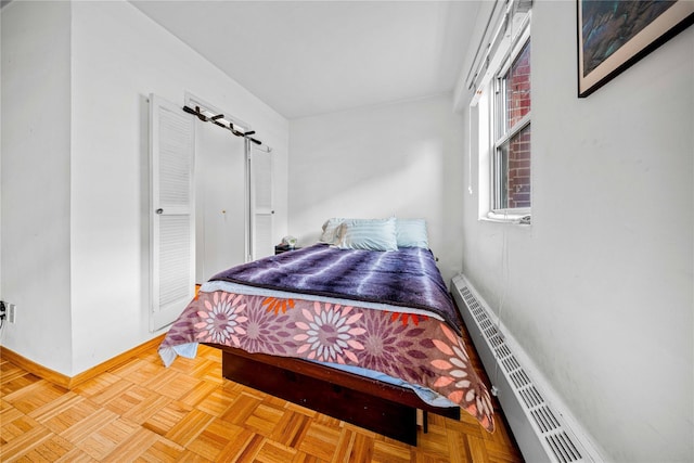 5230 39th Dr Unit 7M, Woodside, NY 11377 - bedroom featuring a baseboard heating unit and baseboards
