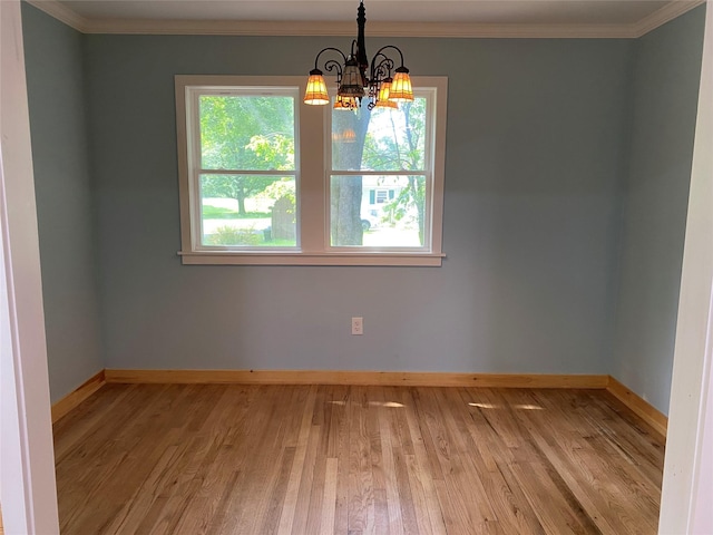 9 Roger Ct, Red Hook, NY 12571 - spare room featuring a chandelier, wood finished floors, and ornamental molding