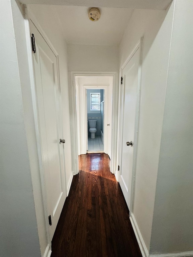 77-04 141st St Unit 67F, Flushing, NY 11367 - hallway featuring dark wood-style floors and baseboards