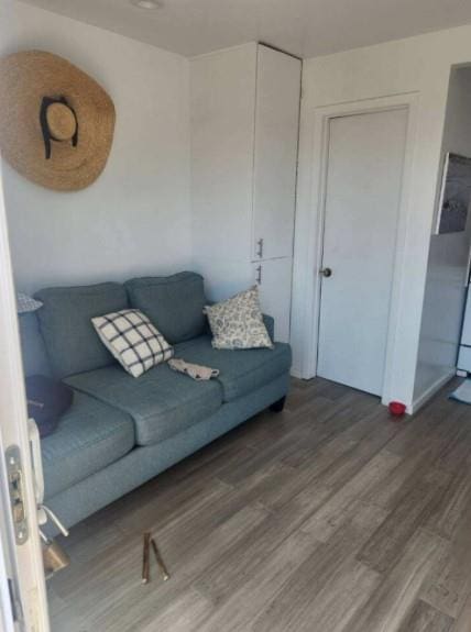 176 Ocean Walk Unit 17, Cherry Grove, NY 11782 - living room featuring wood finished floors