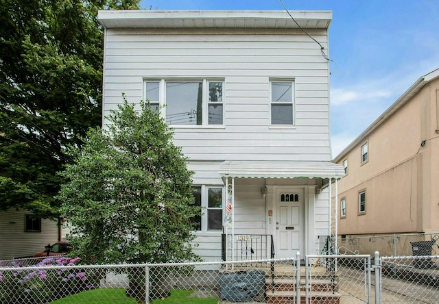 13-19 126th St, College Point, NY 11356 - view of front of house with a fenced front yard and a gate