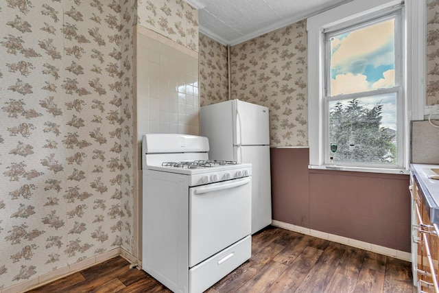 13-19 126th St, College Point, NY 11356 - kitchen featuring white appliances, dark wood-style flooring, wallpapered walls, ornamental molding, and plenty of natural light
