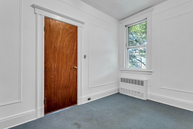 13-19 126th St, College Point, NY 11356 - empty room featuring radiator and dark colored carpet