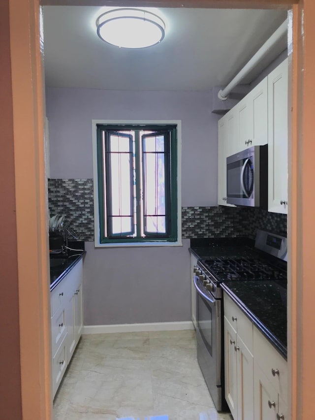 1935 Mcgraw Ave Unit 7C, Bronx, NY 10462 - kitchen featuring stainless steel appliances, tasteful backsplash, and white cabinets