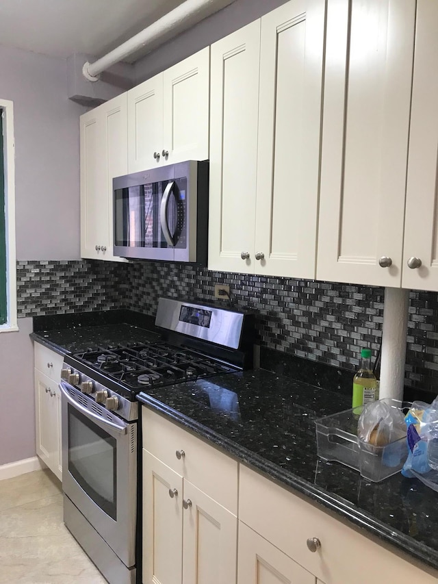 1935 Mcgraw Ave Unit 7C, Bronx, NY 10462 - kitchen with stainless steel appliances, dark stone countertops, and backsplash