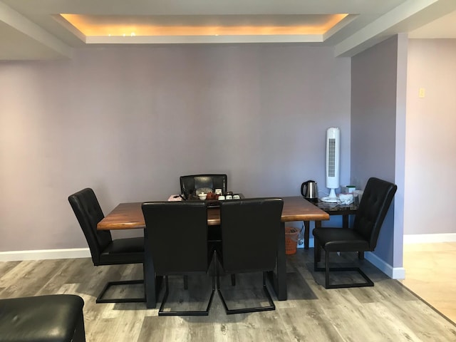 1935 Mcgraw Ave Unit 7C, Bronx, NY 10462 - dining space with a tray ceiling and light wood-style floors