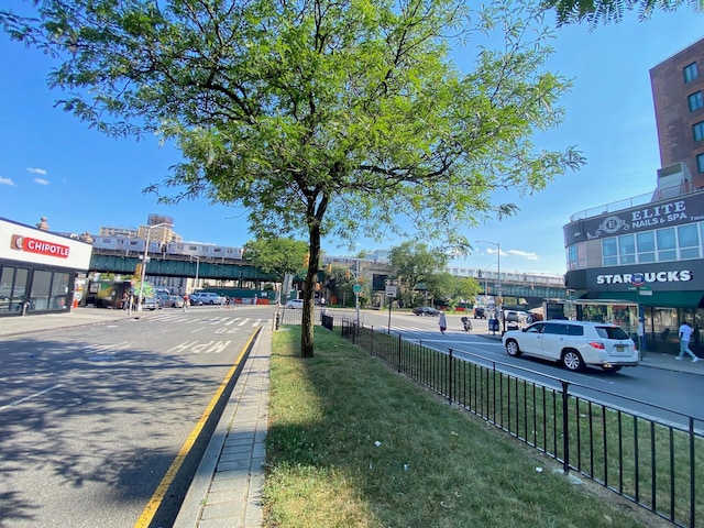1935 Mcgraw Ave Unit 7C, Bronx, NY 10462 - view of asphalt road with curbs, sidewalks, and street lights