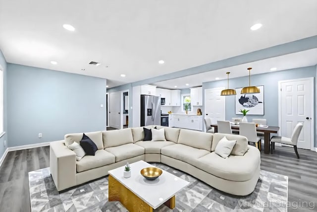 111A Wood Ave, Mastic, NY 11950 - living room featuring recessed lighting and light wood-style flooring