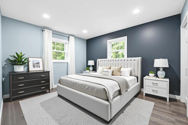 111A Wood Ave, Mastic, NY 11950 - bedroom featuring multiple windows, dark wood-style floors, and recessed lighting