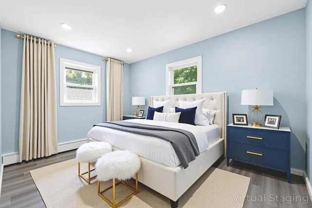 111A Wood Ave, Mastic, NY 11950 - bedroom with multiple windows, dark wood-style floors, a baseboard radiator, and recessed lighting
