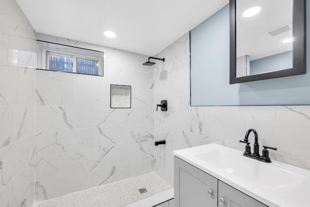 111A Wood Ave, Mastic, NY 11950 - bathroom with vanity, a tile shower, tile walls, and recessed lighting