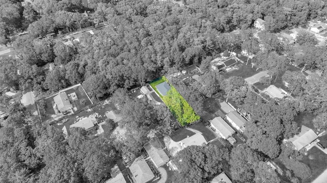 111A Wood Ave, Mastic, NY 11950 - aerial view of property and surrounding area with property parcel outlined and a heavily wooded area