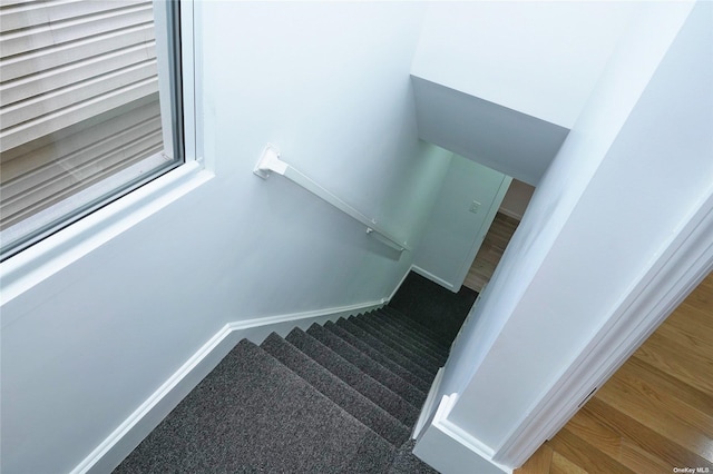 87-44 89th St, Woodhaven, NY 11421 - staircase with wood finished floors and baseboards