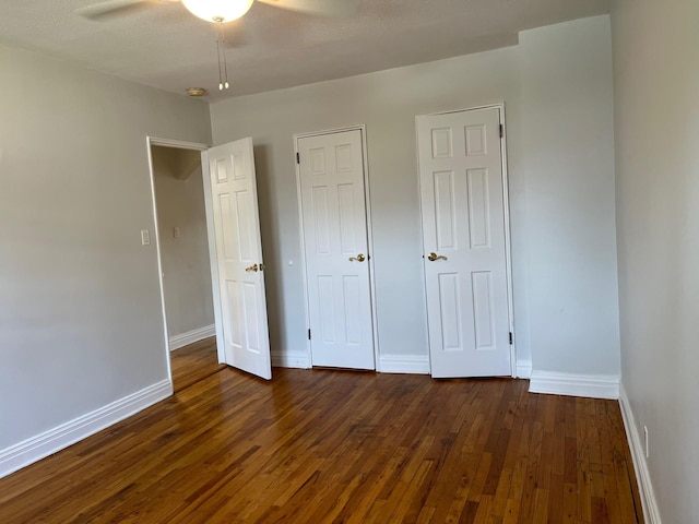 191-09 39th Ave Unit 164, Flushing, NY 11358 - unfurnished bedroom with dark wood finished floors and a ceiling fan