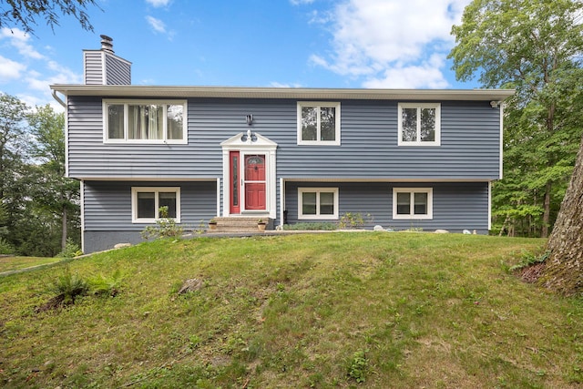 16 Mountain View Dr, Holmes, NY 12531 - raised ranch featuring a front lawn and a chimney