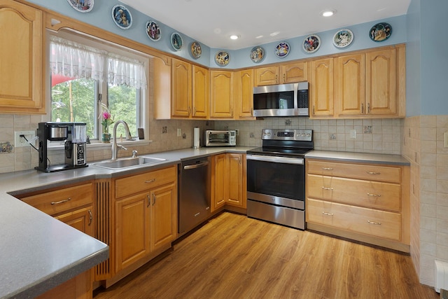 16 Mountain View Dr, Holmes, NY 12531 - kitchen with stainless steel appliances, light wood-type flooring, tasteful backsplash, recessed lighting, and light countertops