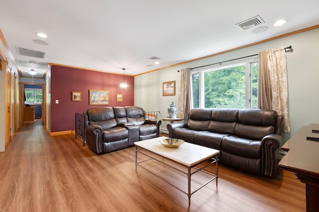 16 Mountain View Dr, Holmes, NY 12531 - living area featuring crown molding, light wood finished floors, recessed lighting, and baseboard heating