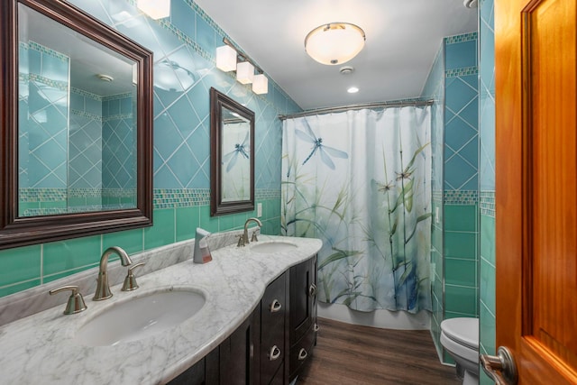 16 Mountain View Dr, Holmes, NY 12531 - full bathroom with tile walls, wood finished floors, double vanity, and a shower with shower curtain