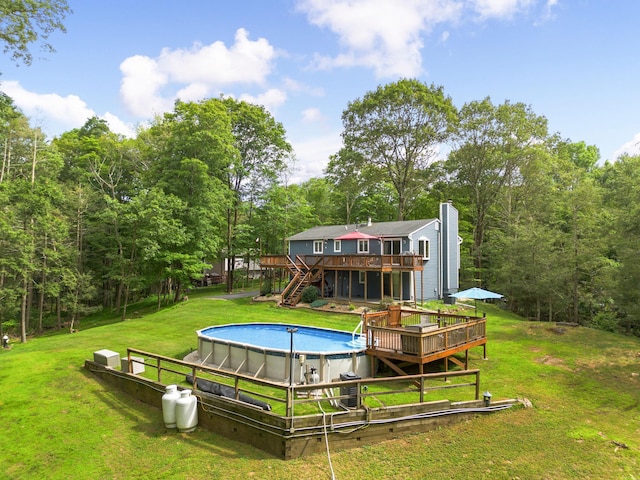 16 Mountain View Dr, Holmes, NY 12531 - outdoor pool featuring a wooden deck, stairway, and a yard