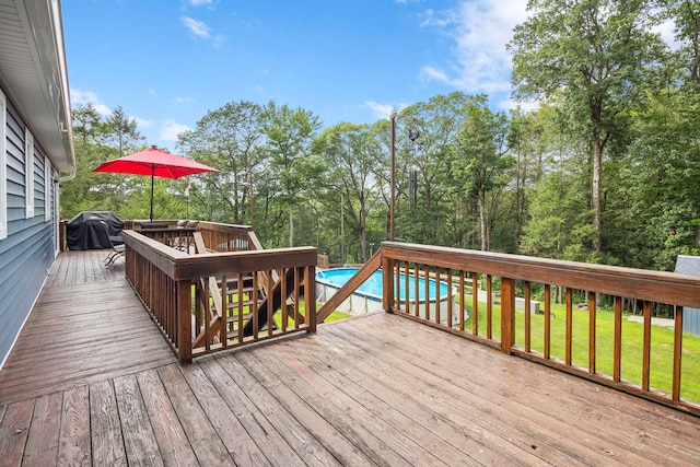 16 Mountain View Dr, Holmes, NY 12531 - deck featuring a grill, an outdoor pool, a yard, and view of wooded area