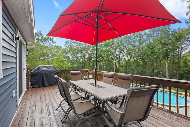 16 Mountain View Dr, Holmes, NY 12531 - wooden terrace with outdoor dining space, area for grilling, an outdoor pool, and view of scattered trees