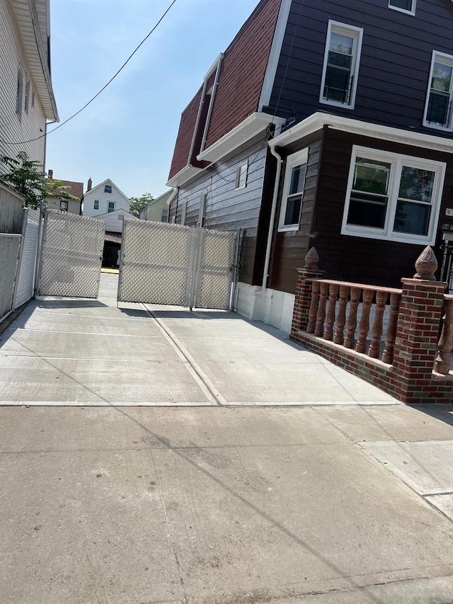 9414 125th St, Richmond Hill, NY 11419 - view of property exterior featuring a gate
