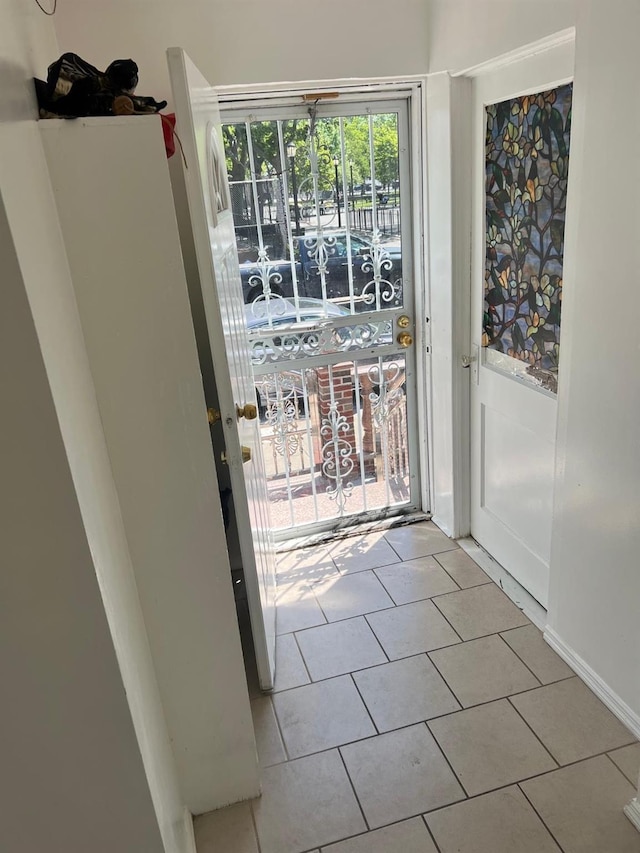 9414 125th St, Richmond Hill, NY 11419 - entryway with tile patterned flooring and baseboards