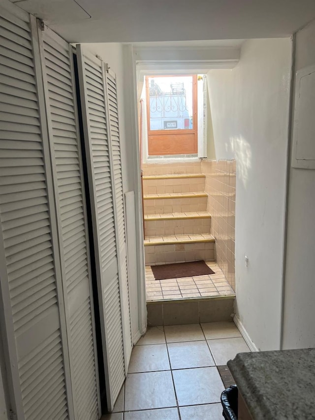 9414 125th St, Richmond Hill, NY 11419 - hall featuring light tile patterned floors and baseboards