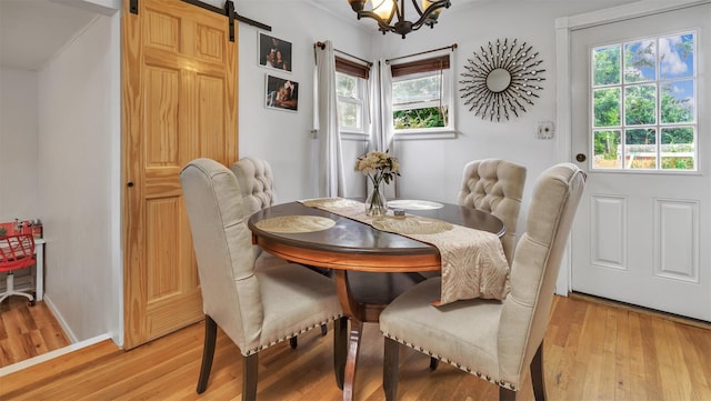 62 Harold Ave, Hempstead, NY 11550 - dining room with light wood finished floors, plenty of natural light, and a chandelier