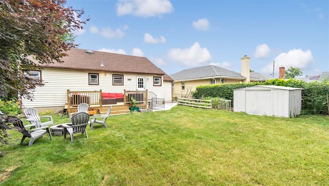 62 Harold Ave, Hempstead, NY 11550 - fenced backyard with a shed and an outdoor living space with a fire pit