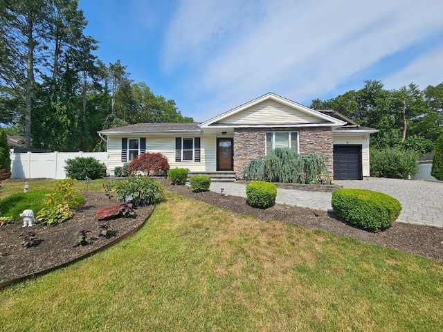 143 N Summit Ave, Patchogue, NY 11772 - single story home with an attached garage, decorative driveway, and stone siding