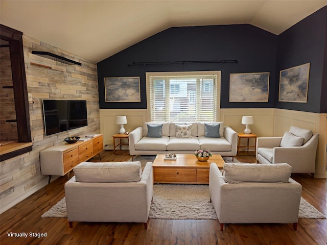 143 N Summit Ave, Patchogue, NY 11772 - living area with wood finished floors, wainscoting, and vaulted ceiling
