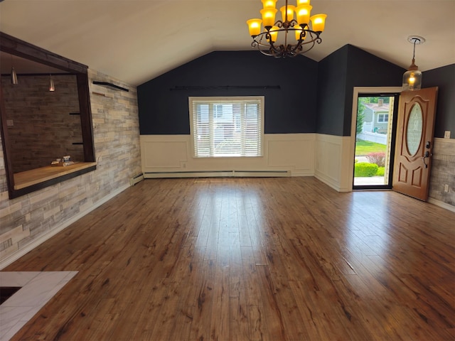 143 N Summit Ave, Patchogue, NY 11772 - unfurnished living room featuring a chandelier, wainscoting, lofted ceiling, wood-type flooring, and a baseboard heating unit