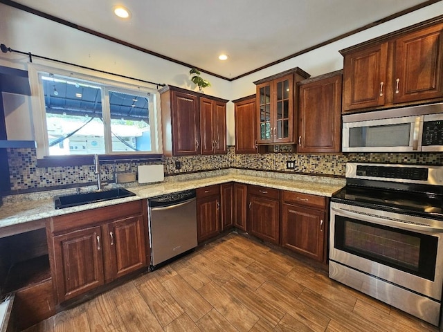 143 N Summit Ave, Patchogue, NY 11772 - kitchen with stainless steel appliances, backsplash, light stone counters, and recessed lighting