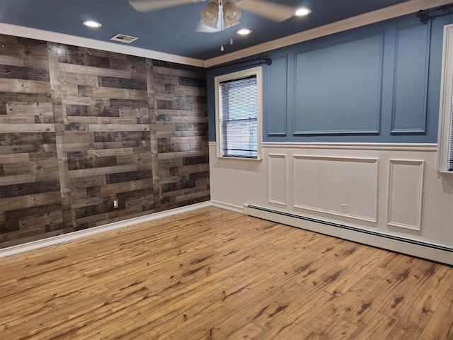 143 N Summit Ave, Patchogue, NY 11772 - empty room featuring ornamental molding, ceiling fan, baseboard heating, wood finished floors, and recessed lighting