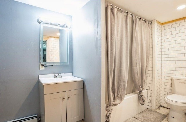 143 N Summit Ave, Patchogue, NY 11772 - bathroom with a baseboard heating unit, vanity, and shower / tub combo with curtain