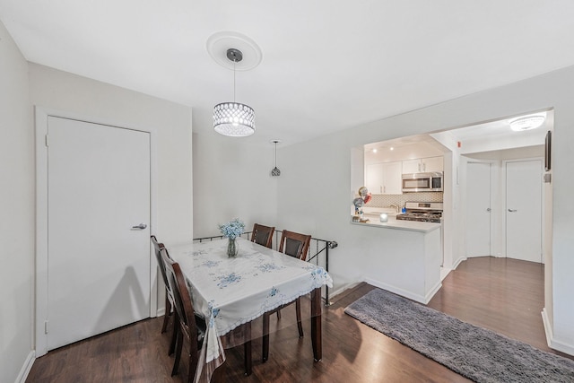 80 Pointe Cir S Unit 80, Coram, NY 11727 - dining space with dark wood-style floors and baseboards