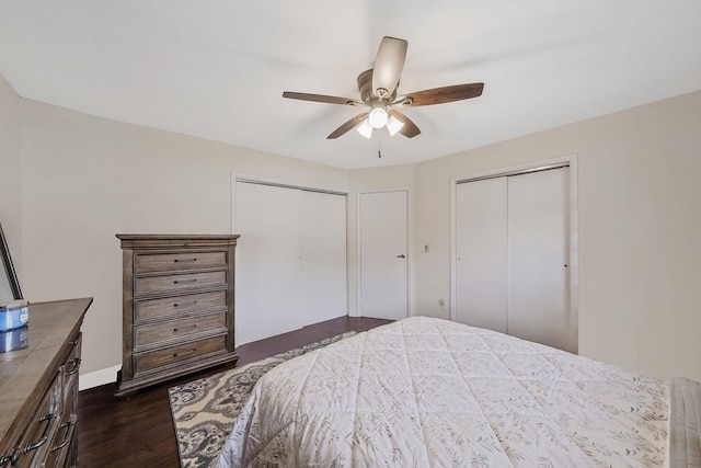 80 Pointe Cir S Unit 80, Coram, NY 11727 - bedroom featuring two closets, dark wood finished floors, and a ceiling fan