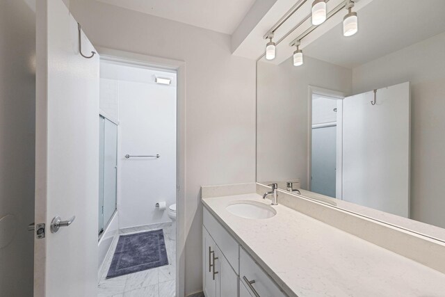 80 Pointe Cir S Unit 80, Coram, NY 11727 - bathroom with vanity, bath / shower combo with glass door, and marble look tiles