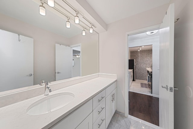 80 Pointe Cir S Unit 80, Coram, NY 11727 - ensuite bathroom featuring vanity and marble finish flooring