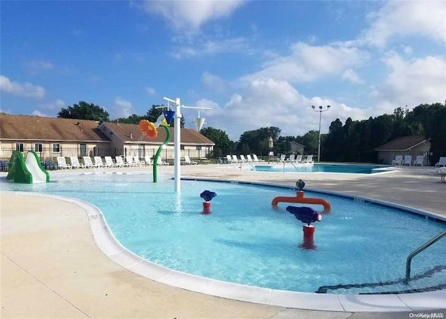 80 Pointe Cir S Unit 80, Coram, NY 11727 - community pool featuring a patio