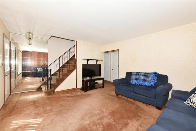42 N Coleman Rd, Centereach, NY 11720 - living room featuring carpet flooring and stairway