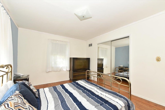 42 N Coleman Rd, Centereach, NY 11720 - bedroom with wood finished floors and crown molding