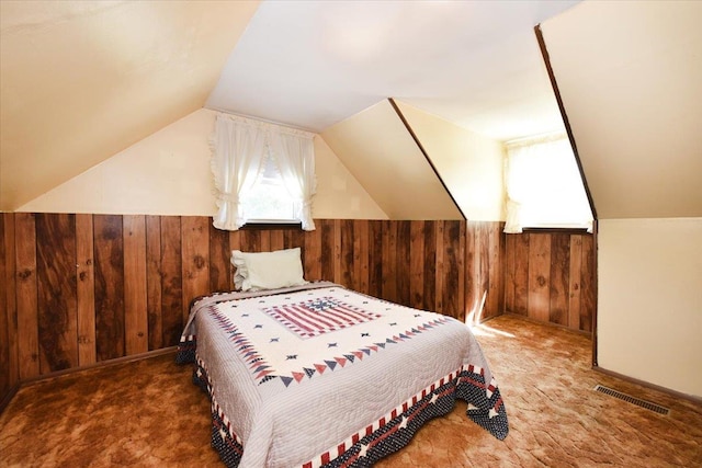 42 N Coleman Rd, Centereach, NY 11720 - carpeted bedroom featuring wooden walls and lofted ceiling